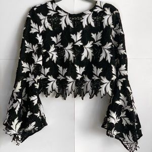 Crochet style black and white bell sleeve crop top